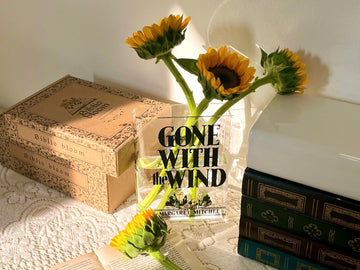 Reading nook with sunflowers in a vase, vintage books, Gone With the Wind cover, lace tablecloth