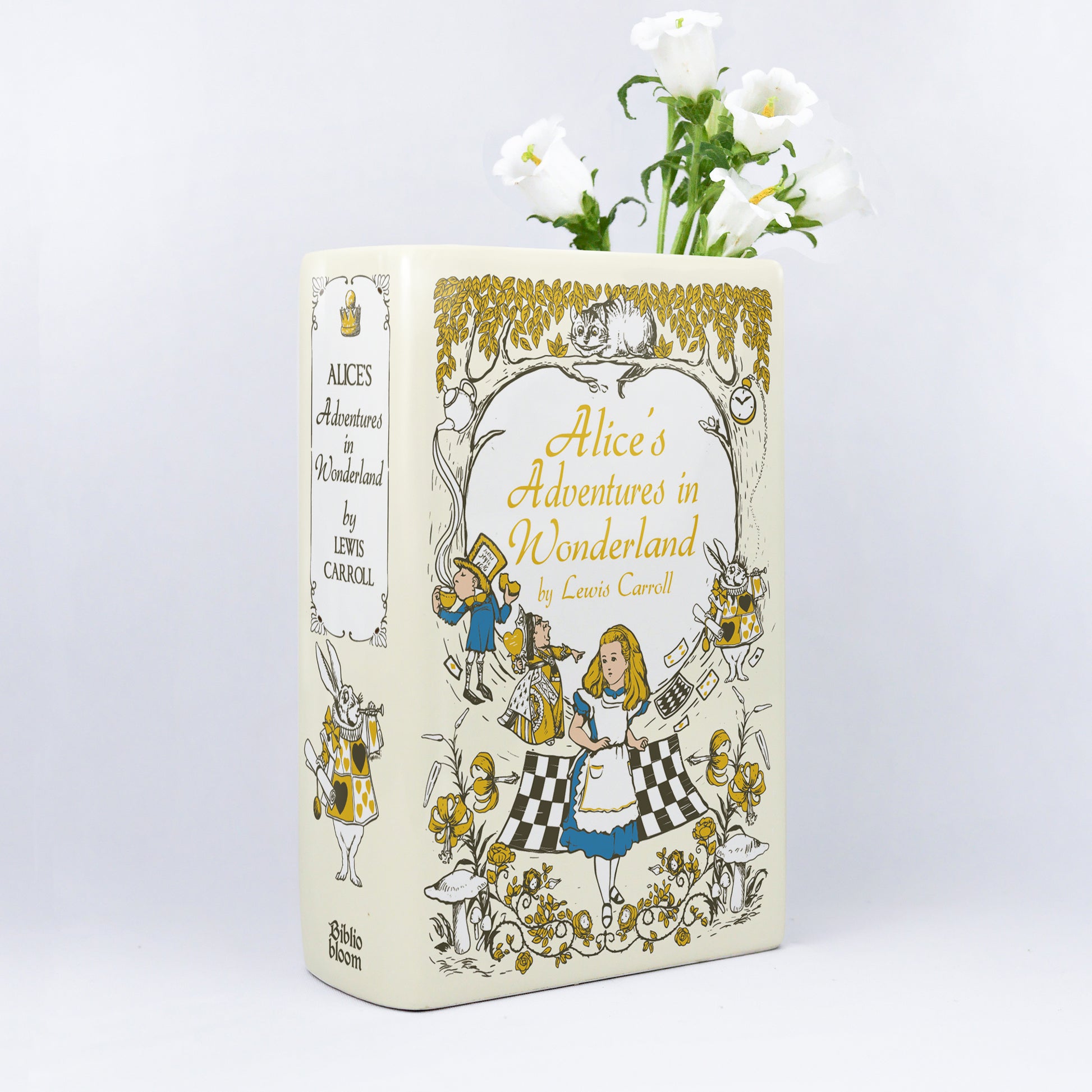 c75eb243-275e-4d80-976a-23aafb739cbb/Alice_s_Adventures_in_Wonderland_-_Ceramic_Book_Vase_II_-_mockup_hoa_t_i.jpg