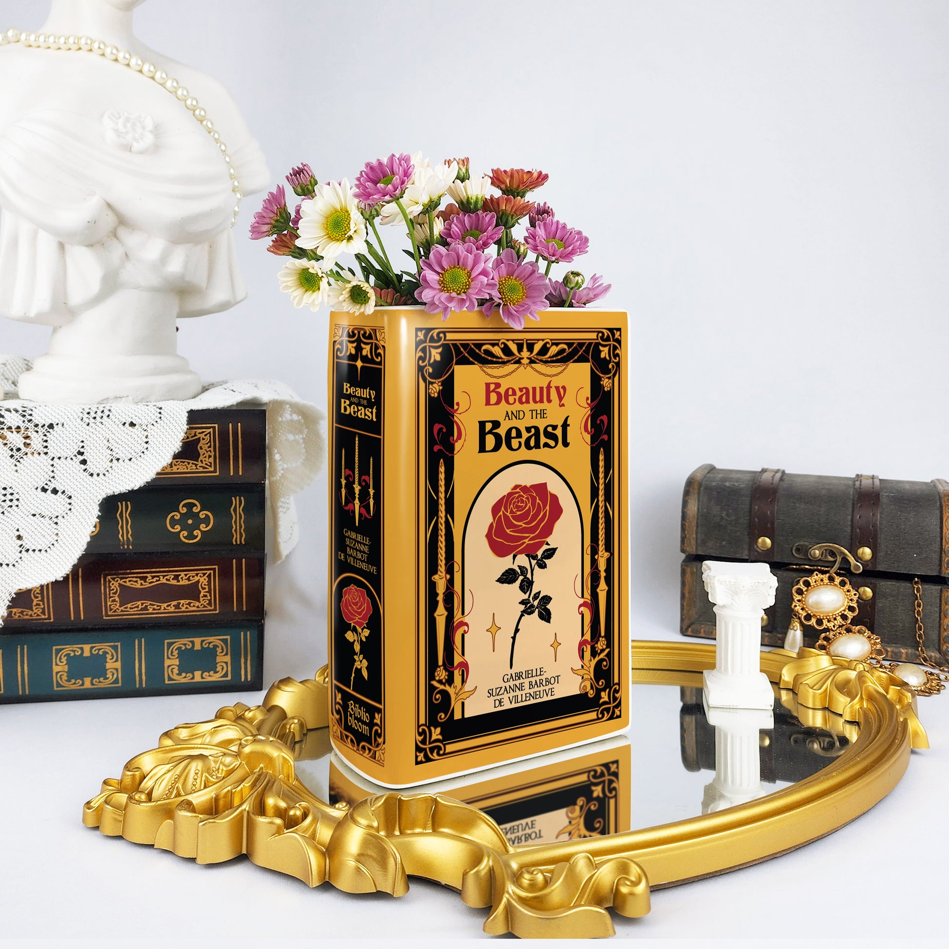 8bf90486-5a69-455b-ab9c-cd63c4402927/Beauty_and_the_beast-Ceramic_Bookish_Vase-Ceramic_book_vase_-_mockup_07_-_ph_i_c_nh_m_t_tr_c_gay_trai.jpg