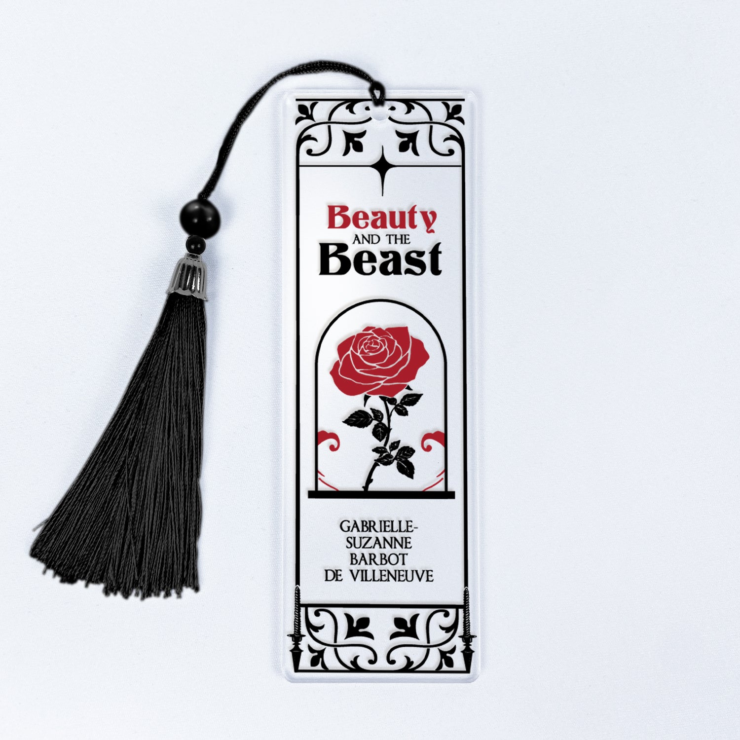 Beauty and the Beast bookmark with red rose, black tassel, ornate border design.