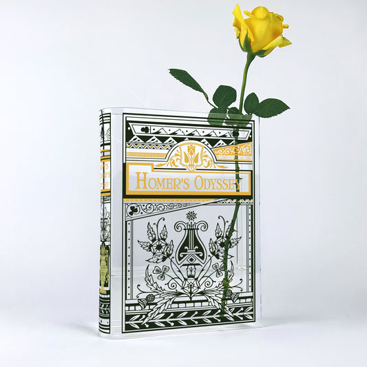 Acrylic book-shaped vase designed as Homer's Odyssey with a single yellow rose