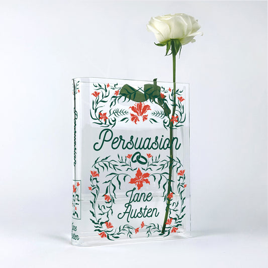Acrylic book vase styled as Jane Austen's Persuasion holding a single white rose