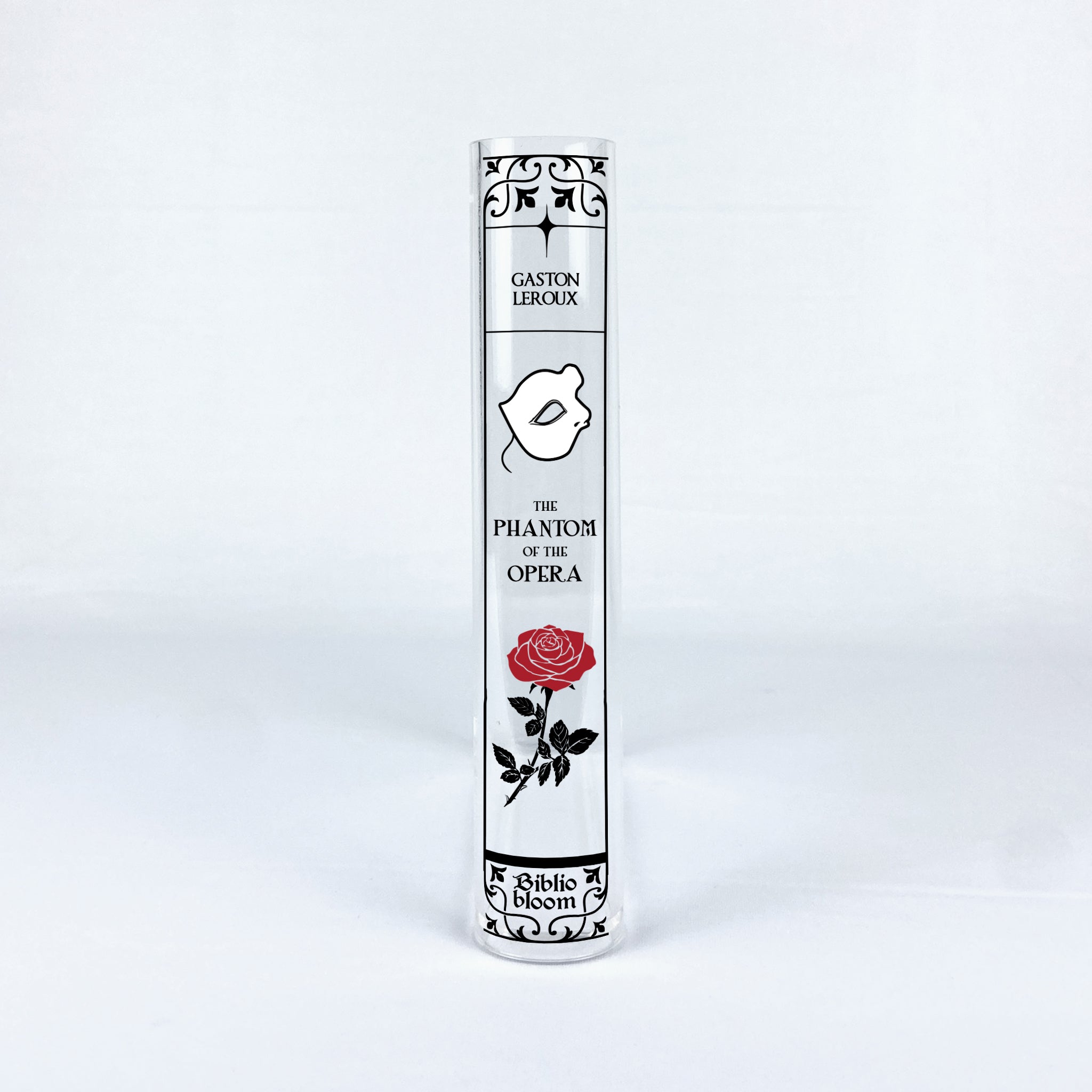 The Phantom of the Opera acrylic book vase with mask and red rose design on white background