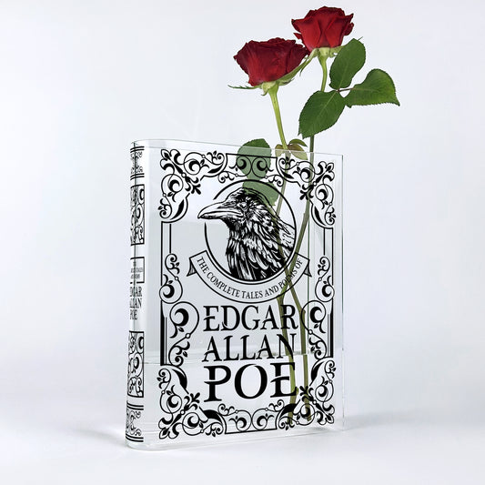 Edgar Allan Poe acrylic book vase with two red roses against white background