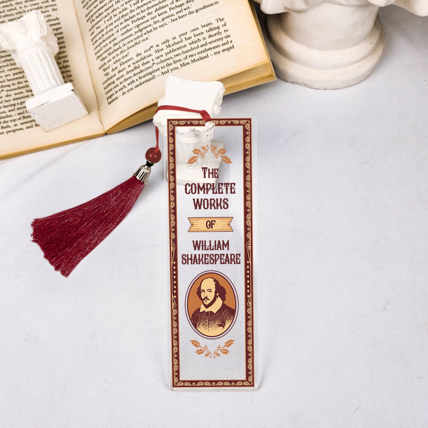 William Shakespeare bookmark with red tassel on open book and white statue, literary gift