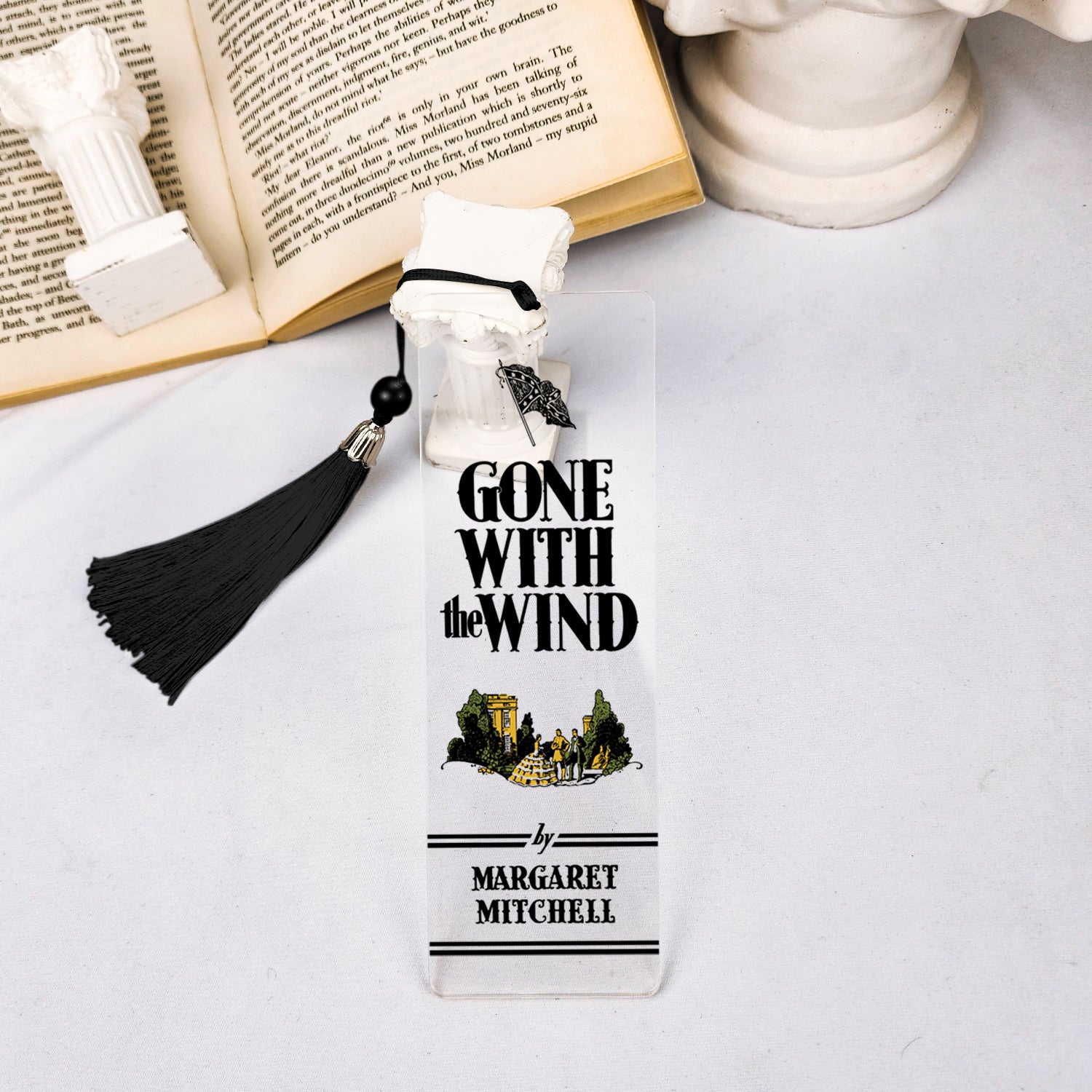 Gone With the Wind acrylic bookmark with black tassel, book and white column decor on table